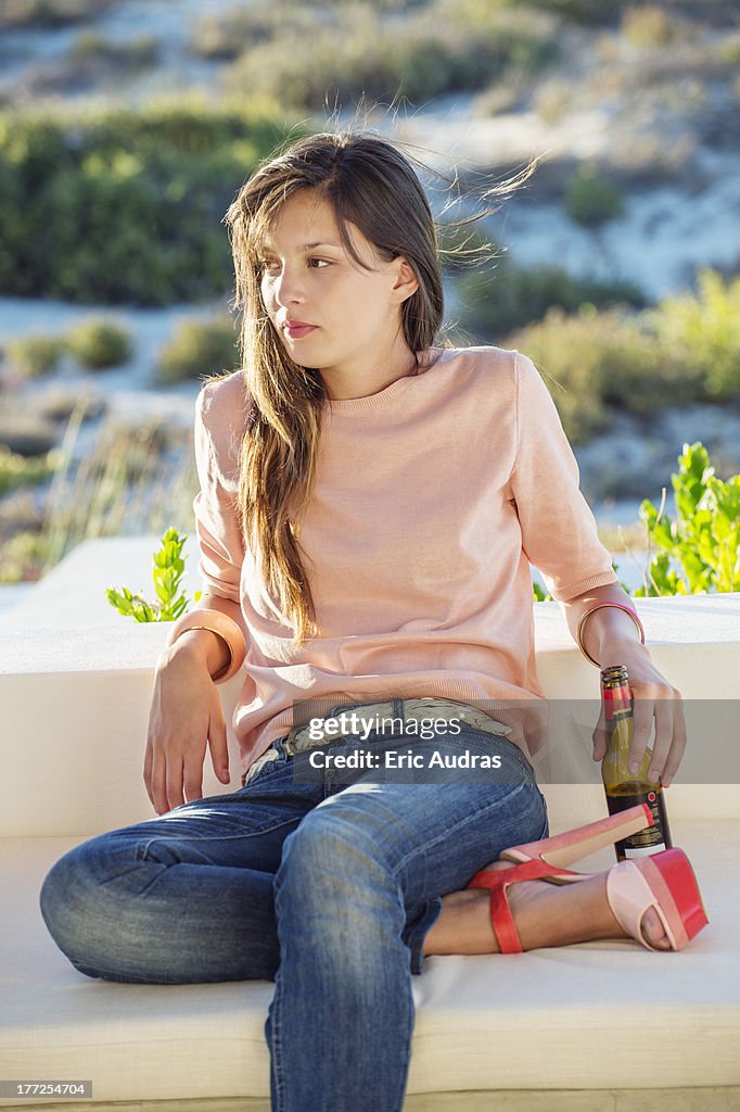 Woman enjoying beer outdoors