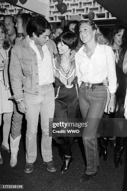 Chad McQueen, Neile Adams, and Terry McQueen attend an event at the Santa Monica Civic Auditorium in Santa Monica, California, on May 11, 1982.