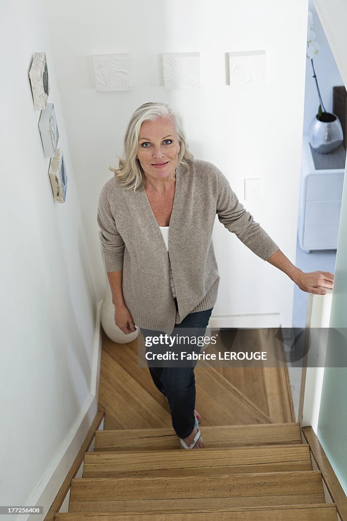 Woman moving up on a staircase