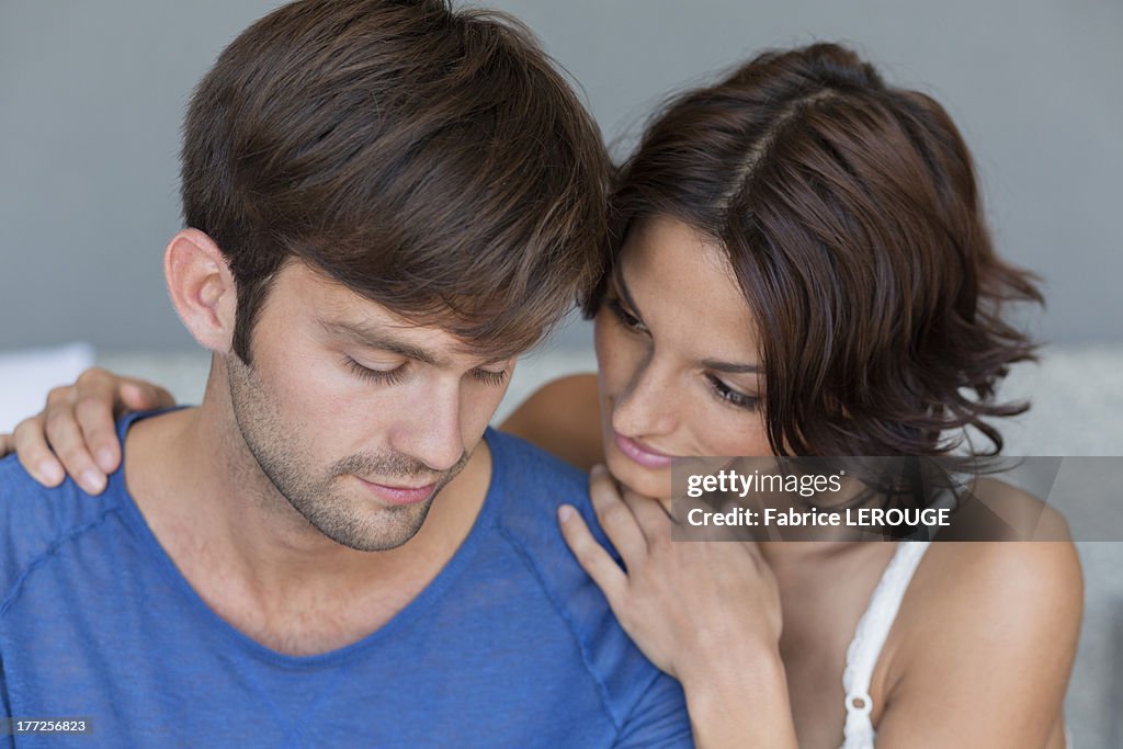 Woman persuading her upset husband