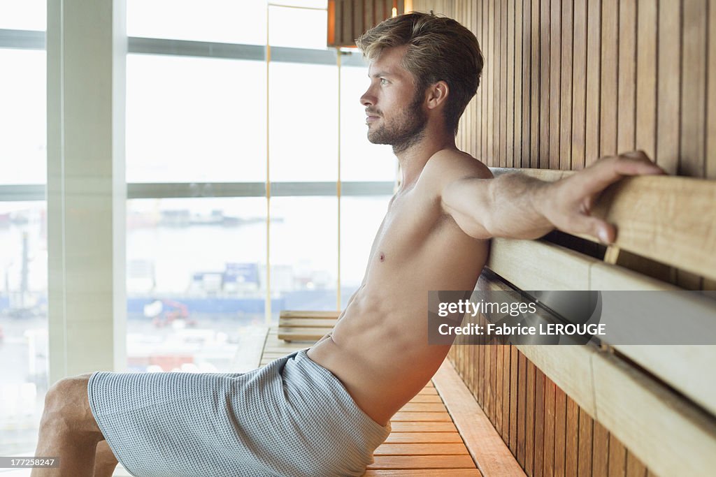 Man relaxing in a sauna