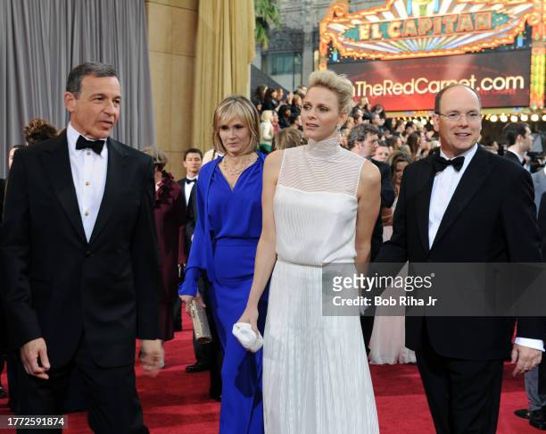 Disney CEO Robert Iger and wife Journalist Willow Bay with Prince Albert II of Monaco and his wife Princess Charlene as they arrive for the 84th...