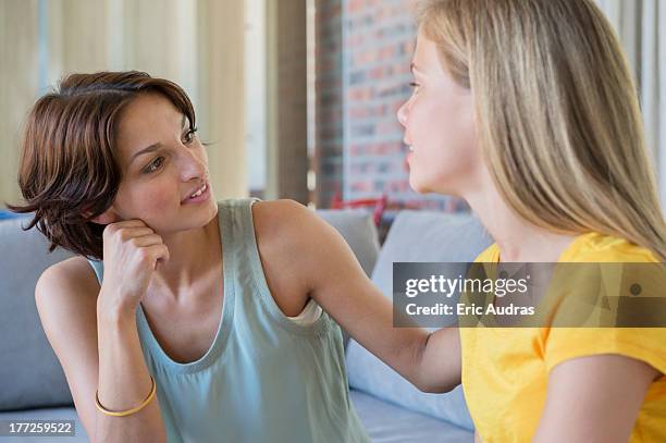 woman talking to her daughter - stiefmutter stock-fotos und bilder