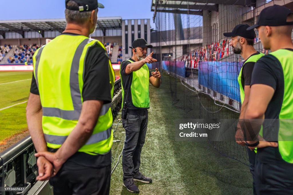 Soccer field security guards talking