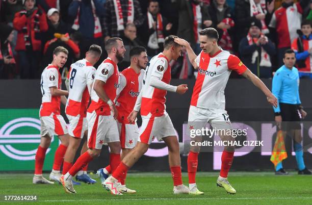 Slavia Prague's players celebrate after Slavia Prague's Czech forward Vaclav Jurecka scored the opening goal during the UEFA Europa League Group G...