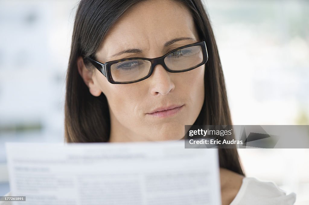 Close-up of a woman reading a document