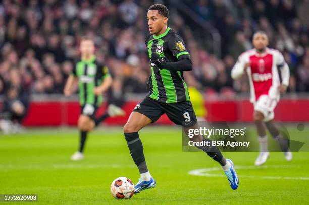 Joao Pedro of Brighton & Hove Albion runs with the ball during the UEFA Europa League 2023/24 Group B match between AFC Ajax and Brighton & Hove...