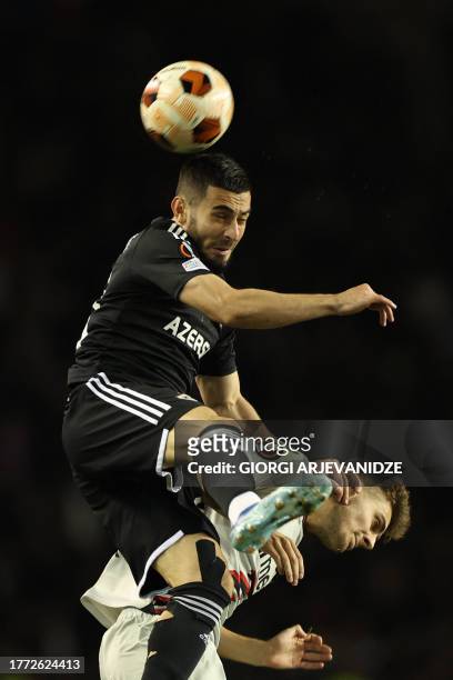 Garabagh's French forward Abdellah Zoubir fights for the ball with Bayer Leverkusen's Croatian defender Josip Stanisic during the UEFA Europa League...