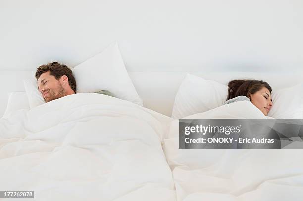 couple sleeping on the bed - couple sleeping 個照片及圖片檔