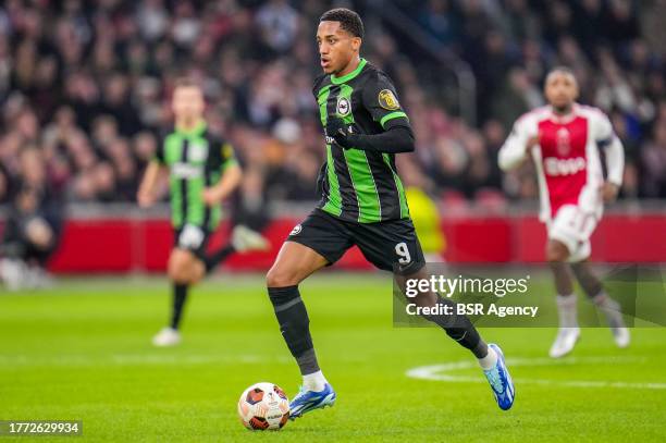 Joao Pedro of Brighton & Hove Albion runs with the ball during the UEFA Europa League 2023/24 Group B match between AFC Ajax and Brighton & Hove...