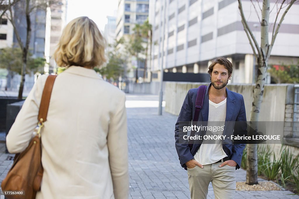 Man and woman walking on a street