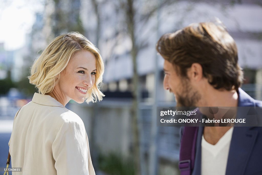 Man and woman smiling at each other