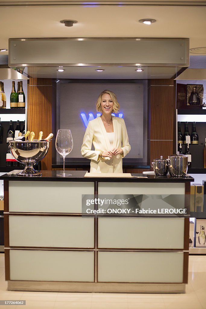 Portrait of a bartender smiling at a counter