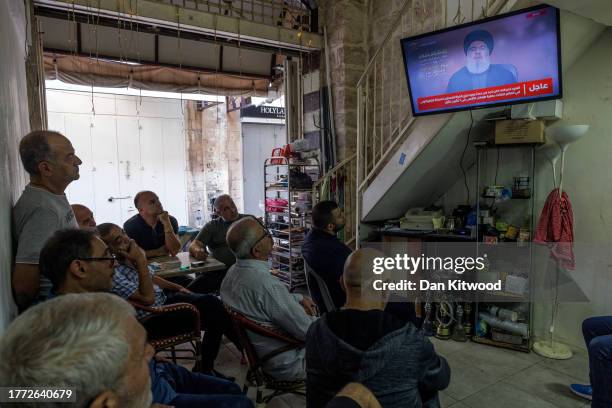 Men watch a live televised speech by Lebanon's Hezbollah chief Hasan Nasrallah, on November 03, 2023 in Old City of Jerusalem. The much anticipated...