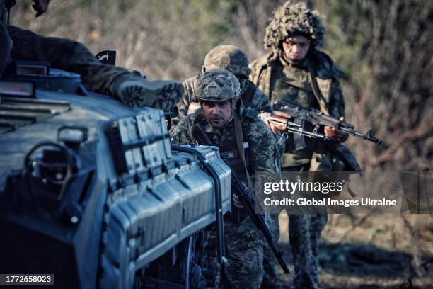 Ukrainian soldiers from 108th Separate Mountain Assault Battalion go after the APC on November 2, 2023 in Donetsk Oblast, Ukraine. During the 2022...