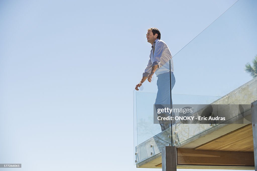 Man standing on the terrace looking away