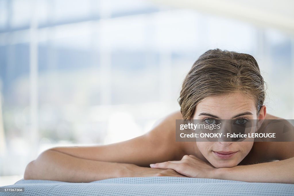 Woman lying on a massage table
