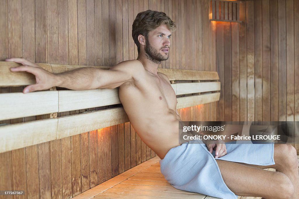 Man relaxing in a sauna