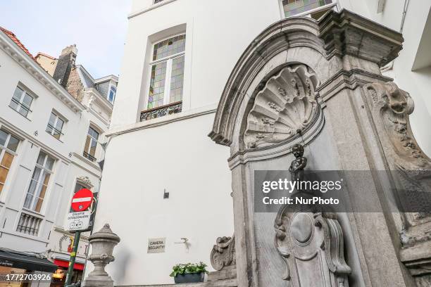 Daily life in Brussels with crowds at one of the tourist attractions in the city, the Manneken Pis or the Little man Pee or peeing boy or le Petit...