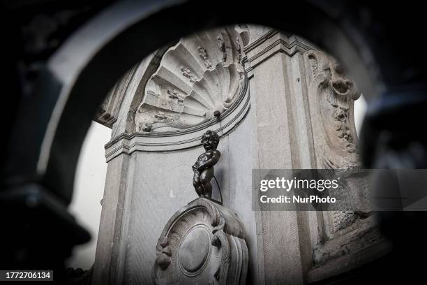 Daily life in Brussels with crowds at one of the tourist attractions in the city, the Manneken Pis or the Little man Pee or peeing boy or le Petit...