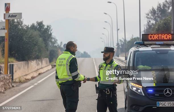 Two Guardia Civil officers in an area affected by the fire, on November 3 in Ador, Valencia, Valencian Community, Spain. The forest fire declared...