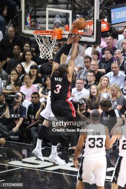 Dwayne Wade of the Miami Heat is blocked by Tiago Splitter of the San Antonio Spurs during Game Five of the 2014 NBA Finals on June 15, 2014 at AT&T...