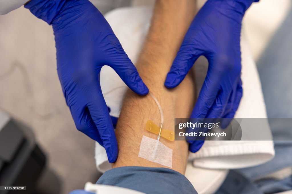 Inserting Catheter Into Vein In Patients Arm In Hospital Medicinal ...