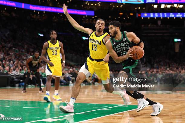 Jayson Tatum of the Boston Celtics drives to the basket against Jordan Nwora of the Indiana Pacers during the second half at TD Garden on November...