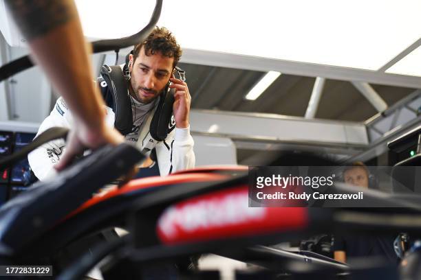 Daniel Ricciardo of Australia and Scuderia AlphaTauri prepares to drive in the garage during practice ahead of the F1 Grand Prix of Brazil at...
