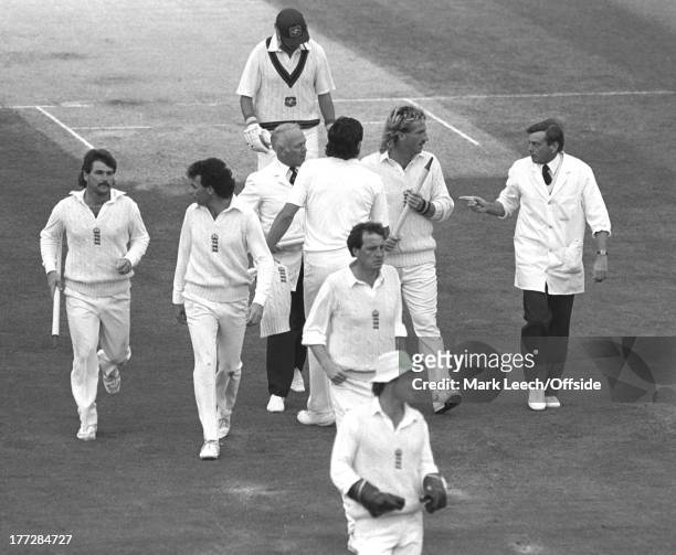Cricket at The Oval, England v Australia, Umpire Dickie Bird appears to warn Ian Botham as he leaves the Oval pitch with a souvenir stump as Les...