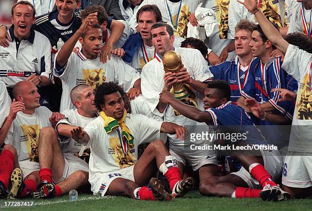 Paris - World Cup - France v Brazil, France celebrate winning the World Cup, Thierry Henry is next to Zinedine Zidane who holds the cup.