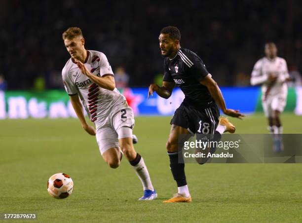 Juninho of Karabakh in action against Josip Stanisic of Bayer Leverkusen during the UEFA Europa Conference League week 4 soccer match between...