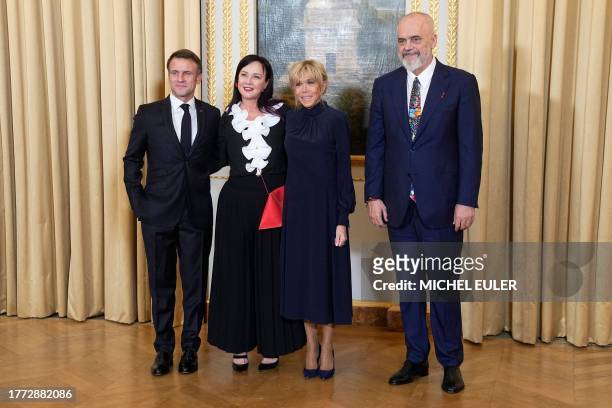 French President Emmanuel Macron and his wife Brigitte Macron pose with Prime Minister of Albania Edi Rama and his wife Linda Rama as they attend a...