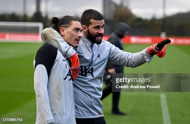 Darwin Nunez and Alisson Becker of Liverpool during a training session at AXA Training Centre on November 03, 2023 in Kirkby, England.