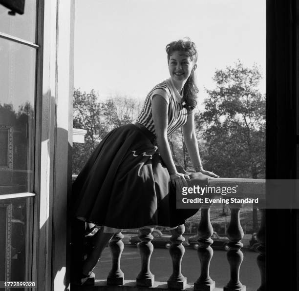 Actress Janette Scott sitting on a window balustrade, October 29th 1956.