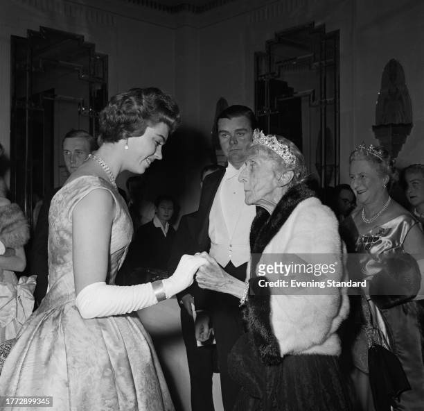 Princess Margaretha Of Sweden, left, holds the hand of Louise Mountbatten , October 29th 1956.