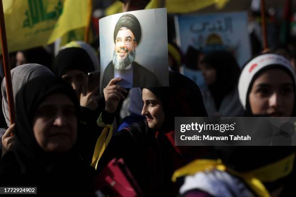 Supporters of Hezbollah gather at al-Ashoura square in southern suburbs of Beirut to listen to the speech of the Secretary-general of Hezbollah...