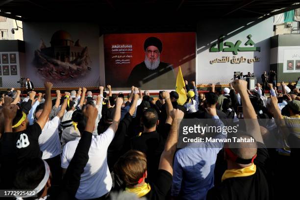 Supporters of Hezbollah gather at al-Ashoura square in southern suburbs of Beirut to listen to the speech of the Secretary-general of Hezbollah...
