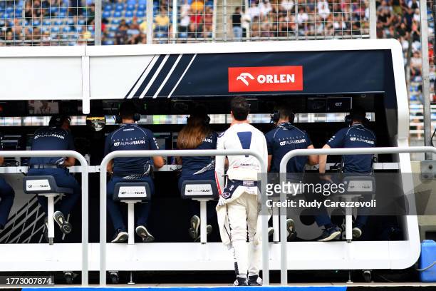 Daniel Ricciardo of Australia and Scuderia AlphaTauri looks on from the pitwall prior to qualifying ahead of the F1 Grand Prix of Brazil at Autodromo...