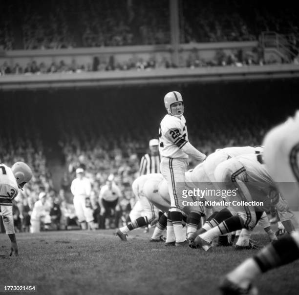 Bobby Layne of the Pittsburgh Steelers makes a call at the line of scrimmage during a game against the New York Giants at Yankee Stadium on October...