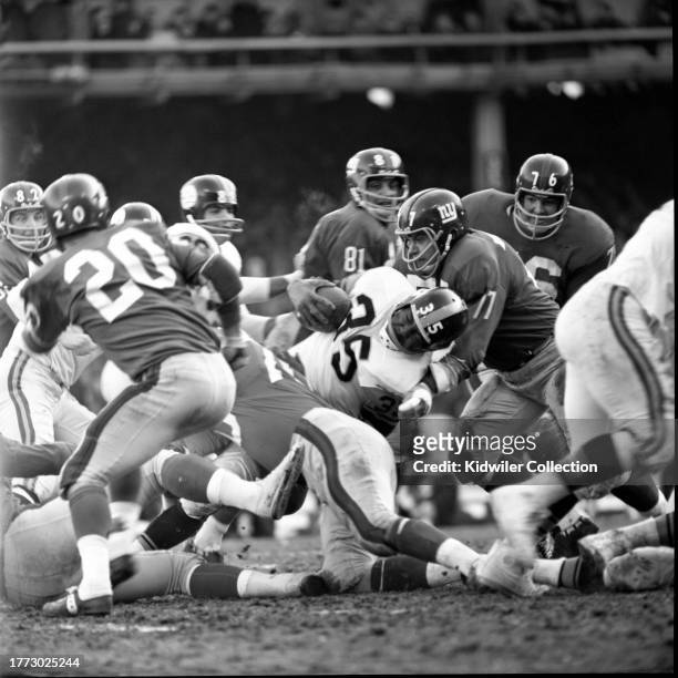 Dick Mozelewski of the New York Giants tackles John Henry Johnson of the Pittsburgh Steelers during a game at Yankee Stadium on December 15, 1963 in...