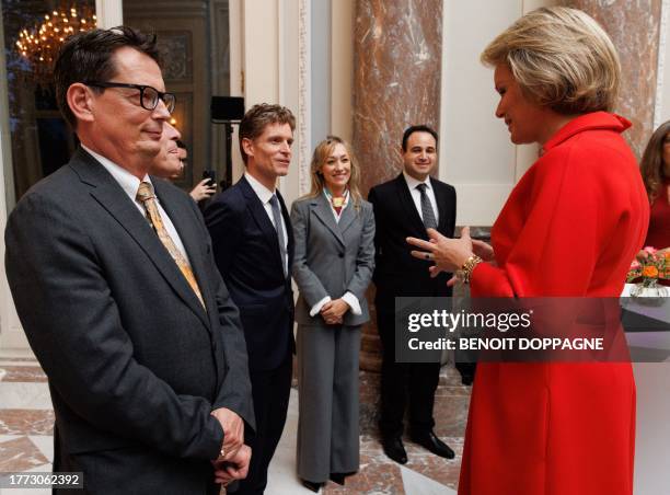 Queen Mathilde of Belgium talks to Belgain Ambbasador to Angola Stephane Doppagne during a reception of the Belgian diplomats during the Diplomatic...