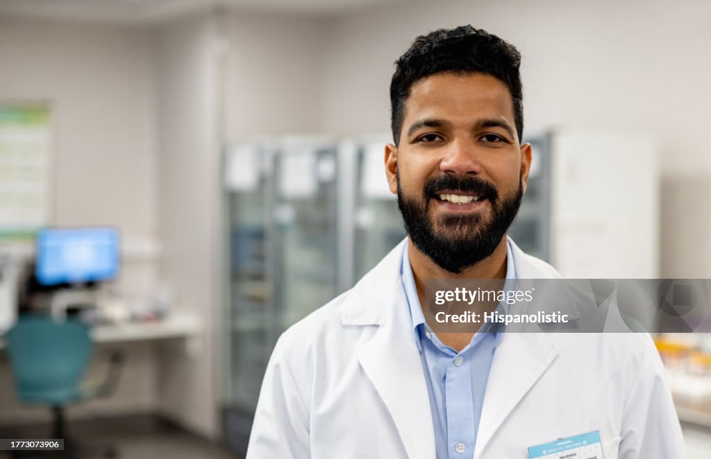 Happy doctor working at the hospital laboratory