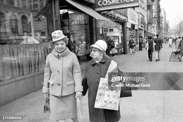 Two elderly women shoppers strolling on Broadway on the Upper West Side of New York City, 1971.