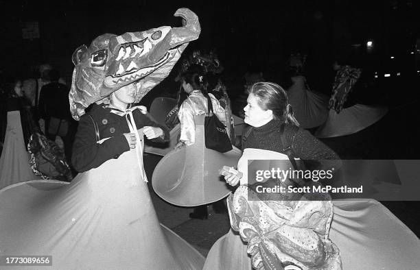 View of a costumed people, all wearing hoop skirts, included one with an elaborate mask, during the 30th annual Village Halloween Parade, on 6th...