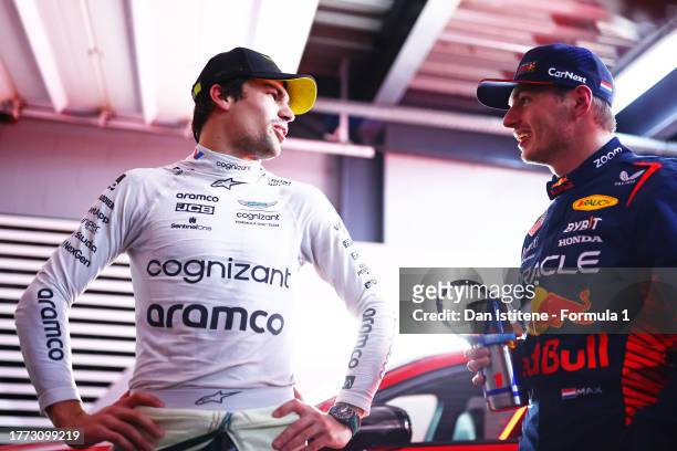 Pole position qualifier Max Verstappen of the Netherlands and Oracle Red Bull Racing and third placed qualifier Lance Stroll of Canada and Aston...