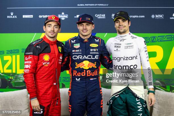 Charles Leclerc of Monaco and Ferrari, Max Verstappen of the Netherlands and Red Bull Racing and Lance Stroll of Canada and Aston Martin pose as the...