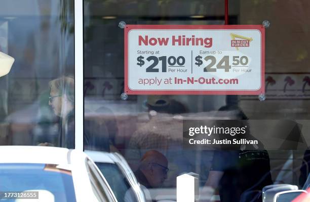 Now hiring sign posted in front of an In-N-Out restaurant on November 03, 2023 in Mill Valley, California. According to a report by the Bureau of...