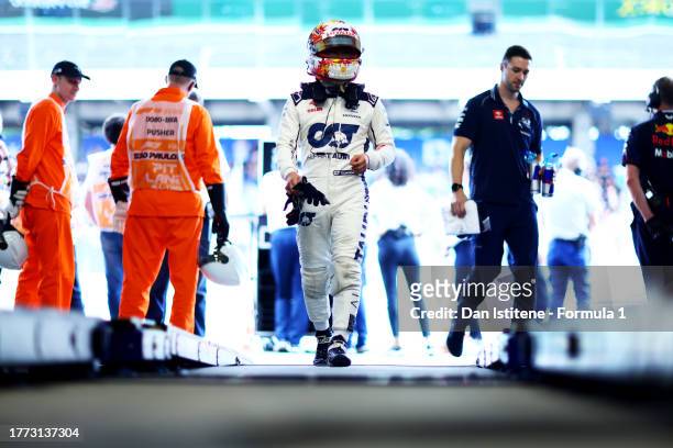 Sixteenth placed qualifier Yuki Tsunoda of Japan and Scuderia AlphaTauri walks into the FIA Garage after qualifying ahead of the F1 Grand Prix of...
