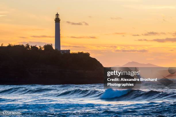 sunset on biarritz lighthouse - biarritz stock pictures, royalty-free photos & images